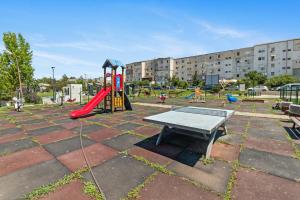 a playground with a bench and a play table at Relax Apartment Eforie in Eforie Nord