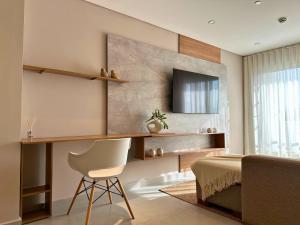 Televisor o centre d'entreteniment de ABIBA Apart-Hotel & SPA