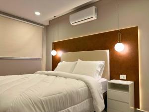 Llit o llits en una habitació de ABIBA Apart-Hotel & SPA