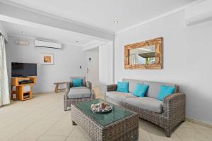 a living room with a couch and a table at Den Laman Condominium Shark in Kralendijk