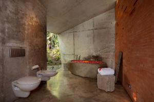 A bathroom at Umah Tampih Luxury Private Villa - CHSE Certified