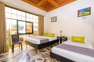 Cama o camas de una habitación en Ayenda 1411 Caney Sede Ingenio