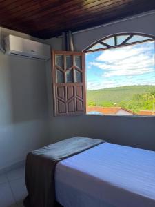 Postel nebo postele na pokoji v ubytování Casa de Zenaide