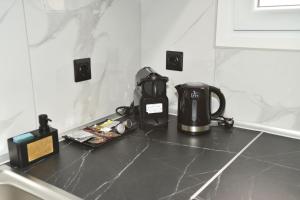 a coffee maker on a counter in a kitchen at Pau'ls Houses 1 in Drama