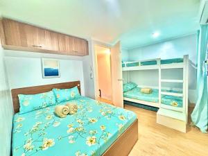 Ένα ή περισσότερα κρεβάτια σε δωμάτιο στο Unit 3 - Affordable Home Near Mactan Cebu Airport