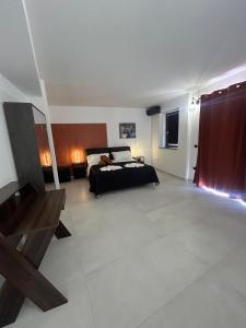 Giường trong phòng chung tại Gammazita Luxury Home