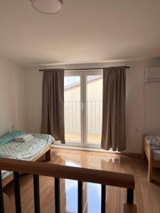 Postel nebo postele na pokoji v ubytování House Kassiopi