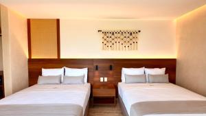 Postel nebo postele na pokoji v ubytování Hotel Makkan Boca