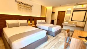 Postel nebo postele na pokoji v ubytování Hotel Makkan Boca