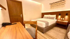 Postel nebo postele na pokoji v ubytování Hotel Makkan Boca