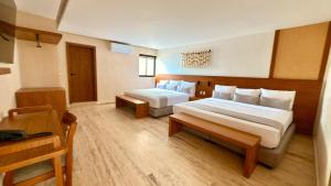 Postel nebo postele na pokoji v ubytování Hotel Makkan Boca