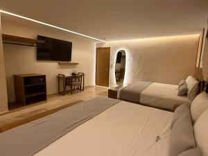 Postel nebo postele na pokoji v ubytování Hotel Makkan Boca