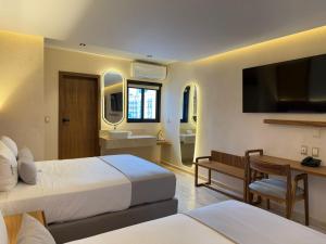 Postel nebo postele na pokoji v ubytování Hotel Makkan Boca