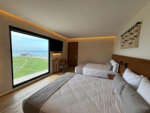 Postel nebo postele na pokoji v ubytování Hotel Makkan Boca