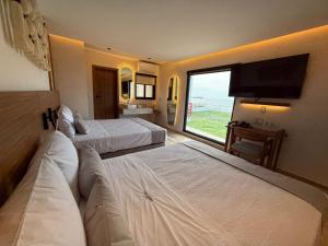 Postel nebo postele na pokoji v ubytování Hotel Makkan Boca