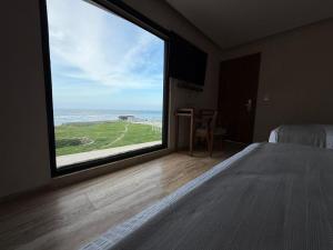 Postel nebo postele na pokoji v ubytování Hotel Makkan Boca