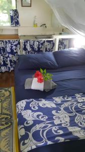 A bed or beds in a room at Matriki Beach Huts