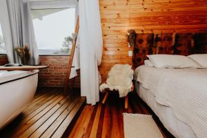 Ένα ή περισσότερα κρεβάτια σε δωμάτιο στο Pousada Quinta das Araucarias