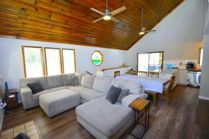 a living room with a couch and a table at SunRidge at Willow Cove in Bass Lake