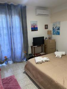 Posteľ alebo postele v izbe v ubytovaní Casa vacanza La Ninfea intera casa