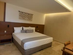 Postel nebo postele na pokoji v ubytování Hotel Makkan Boca
