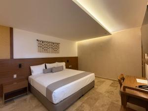 Postel nebo postele na pokoji v ubytování Hotel Makkan Boca