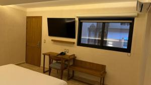 TV a/nebo společenská místnost v ubytování Hotel Makkan Boca