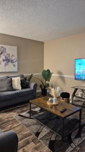 a living room with a couch and a coffee table at A Beautiful Sunset in Clarksville