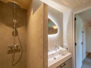a bathroom with a shower and a sink at Luxury holiday home by the sea in Sint Maartenszee +18 photos
