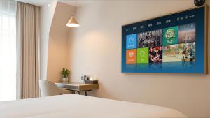Voodi või voodid majutusasutuse 云泊夜酒店浦东机场店Yunboye Hotel Shanghai Pudong Airport Branch toas