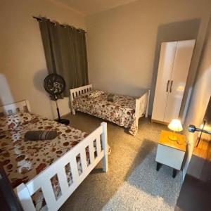 Ένα ή περισσότερα κρεβάτια σε δωμάτιο στο Apartamento aconchegante e localização excelente