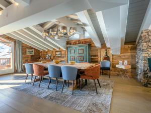 a dining room with a wooden table and chairs at Penthouse de Prestige au Cœur de Val-d'Isère, 5 Ch, Wifi - FR-1-694-430 in Val dʼIsère