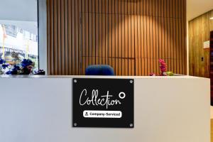 a sign for a office with a blue chair at Collection O Thousand Lights Chennai in Chennai