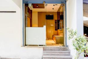 an open door of a building with a staircase at Collection O Thousand Lights Chennai in Chennai +41 photos