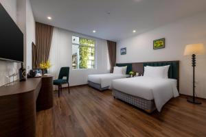 Voodi või voodid majutusasutuse Hanoi Vista Hotel toas