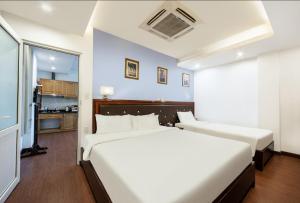 Ένα ή περισσότερα κρεβάτια σε δωμάτιο στο A25 Hotel - 28 Trần Quý Cáp