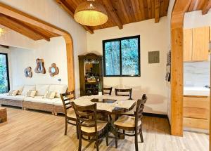 a dining room with a table and chairs at Principitos Universe in San Juan La Laguna +88 photos