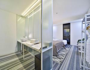 Ένα ή περισσότερα κρεβάτια σε δωμάτιο στο JS Boutique Hotel