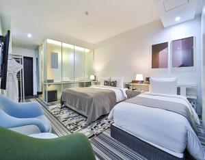 Ένα ή περισσότερα κρεβάτια σε δωμάτιο στο JS Boutique Hotel