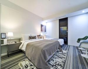 Ένα ή περισσότερα κρεβάτια σε δωμάτιο στο JS Boutique Hotel