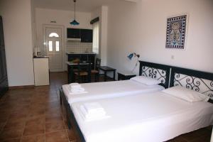 Ένα ή περισσότερα κρεβάτια σε δωμάτιο στο Villa Carina