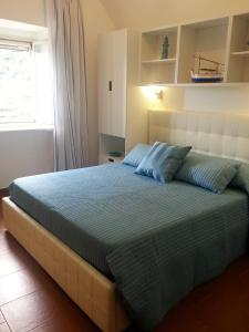 Кровать или кровати в номере Casa Vacanze Bouganvillea