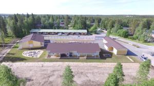 an overhead view of a large house with a garage at Lapland Koivusto Apartment in Ranua