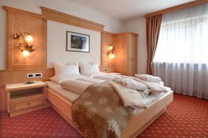 A bed or beds in a room at B&B Appartments Cudlea