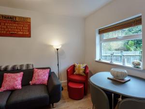 a living room with a couch and a table at Fisherman's Rest in Broadstairs +24 photos