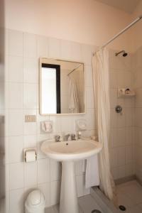Kylpyhuone majoituspaikassa Appart Hotel Residence