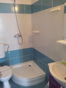 a bathroom with a toilet and a sink at Hotel La John in Vama Veche
