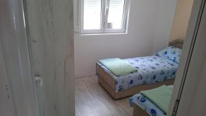 Una cama o camas en una habitación de Apartments Vukovic