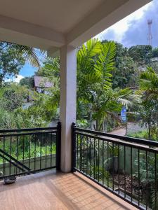 a balcony with a view of the jungle at Kandy Breeze Homestay in Kandy