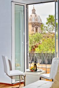 a living room with a view of a building at Pantheon - Argentina Luxury in Rome